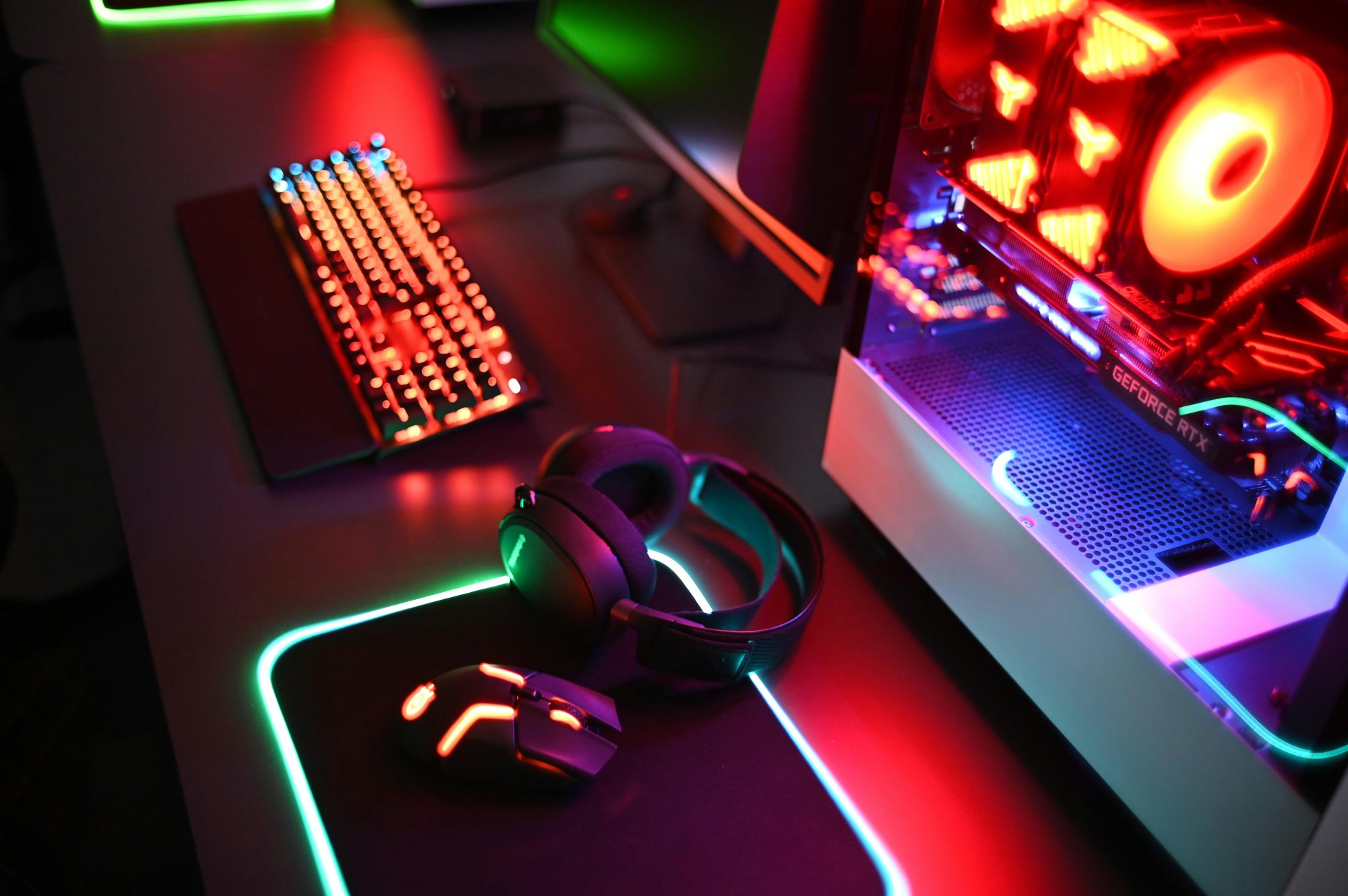 Gaming setup with RGB lights and accessories.
